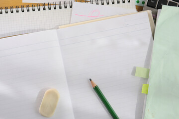 white paper notebook background and pencil, studying concept