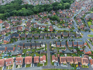 Aerial view of newly built homes in the UK. Estate development masterplan landscape in England - obrazy, fototapety, plakaty
