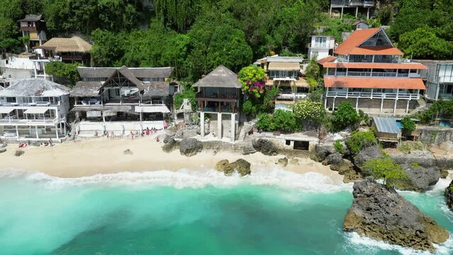 Sandy Shore Of Bingin Beach Bali With Hotels And Restaurants Perched On The Uluwatu Cliffs