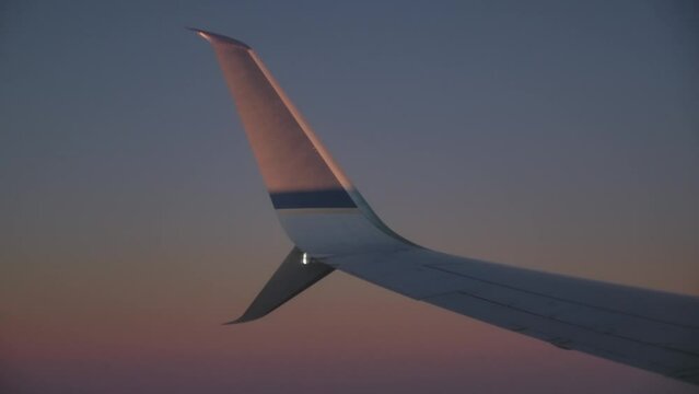 Split-Tip Winglet Design of the Boeing 737 Max Plane in Flight at Dusk