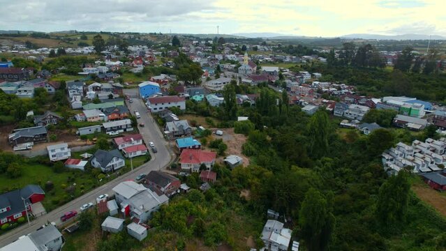 Aerial establishing shot of Chonchi Settlement town in the Chilo&eacute; Island, Chile