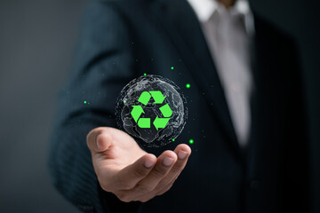 Recycle concept. ecological waste management and sustainable development. Businessman holding globe...