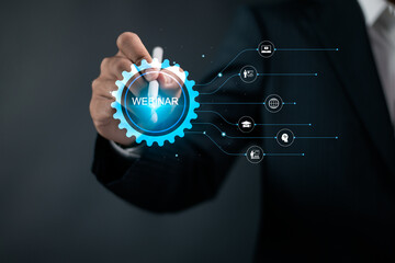 Webinar concept. E-learning training business technology, Internet conference and web based seminar. Businessman touching webinar icon on virtual screen.