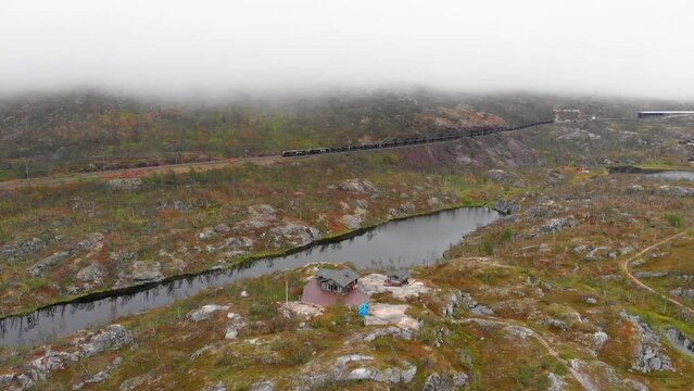 Aerial: ore train in S&oslash;sterbekk stasjon, close to the border between Sweden and Norway in north Lapland