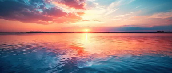 Photo sur Plexiglas Corail Sundown Serenity, A serene sunset painting the sky in hues of pink and orange as it dips below the horizon, its reflection casting a peaceful glow over the gentle ripples of the vast lake