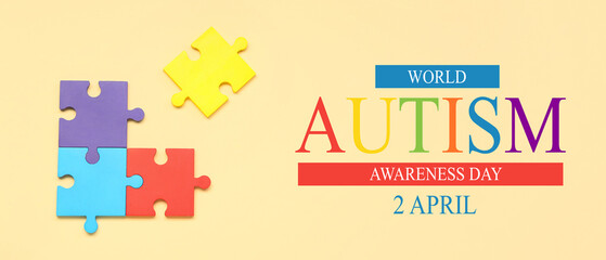 Colorful puzzle pieces on beige background. Concept of autistic disorder