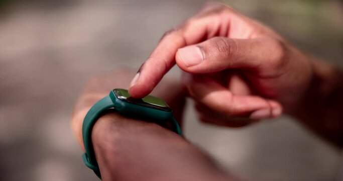 Press, hands or runner in park with smart watch for heart rate to monitor training or cardio exercise. Nature, race progress or healthy man with technology or timer app in running workout for fitness