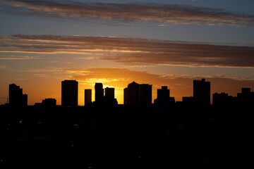 City Skyline Silhouetted at Sunset.