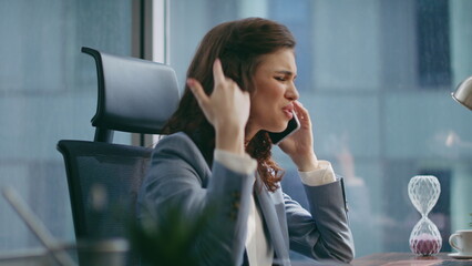 Business girl complaining cellphone conversation dissatisfied work close up.