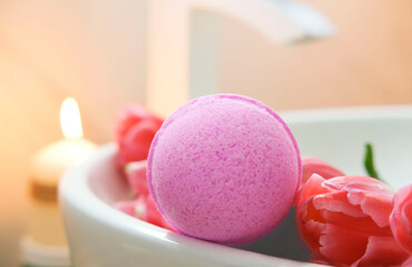 Close-up of pink ball. Scented candle bomb for the bathroom. Therapy concept. Spa at home