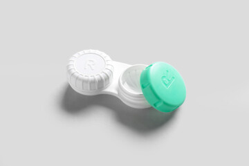 Container for contact lenses on white background