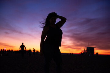 Silhouette of curvy woman with Beach Sunset 