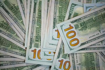 One hundred dollar bills. pile of one hundred US banknotes. Background with money American hundred dollar bills. 100 bills background. Lots of dollars. stamp with US dollar and euro
