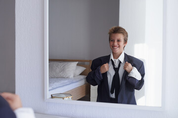 Happy, boy and pretend suit on male person, business wear for dream job or dress up on kid. Smile,...