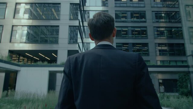 Successful business man in suit looking at camera with confidence