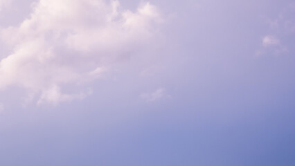 Background of a beautiful pink and pale purple sky with clouds at sunset