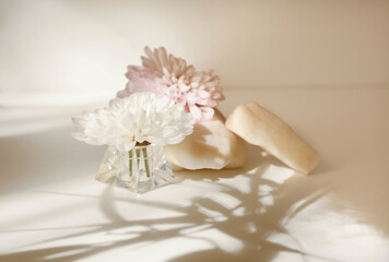 Template, marble podium with stone and flower, soft light pink coloring, empty space. Spa salon,...