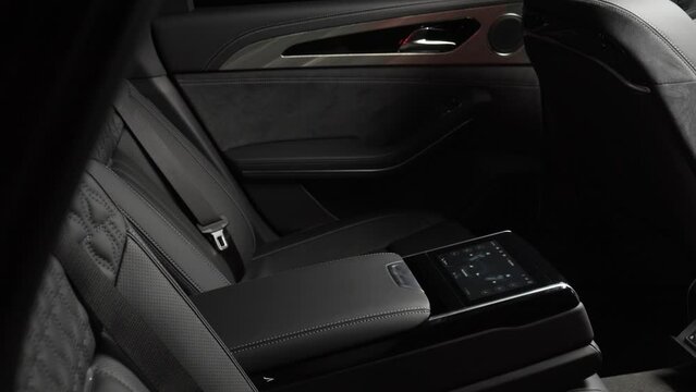 Salon of a premium car. Interior details. Camera moves slowly