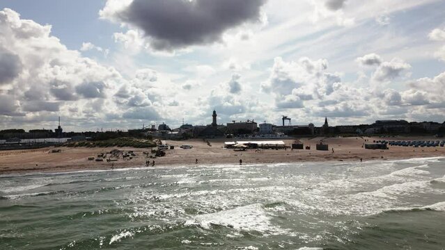 beautiful beach with waves, lighthouse, baltic sea, warnem&uuml;nde, drone