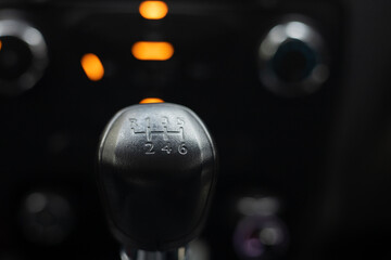 Manual car gear lever, gear position indicator, close-up photo.