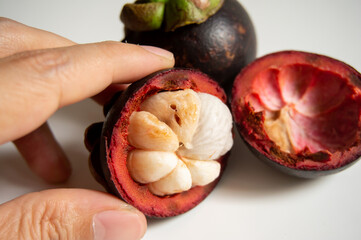 poor quality of mangosteen fruit due to pests on a white background
