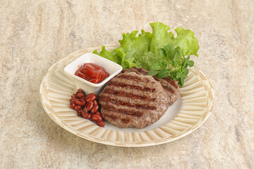Grilled beef burger cutlet with sauce