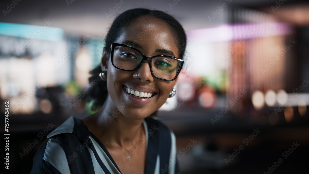 Poster portrait of successful black businesswoman using desktop computer, analysing data, thinking and solv