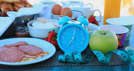 Alarm clock with IF (Intermittent Fasting) 16 and 8 diet rule and weight loss concept.-Diet plan concept