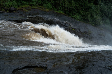 water flowing over rocks in the forest