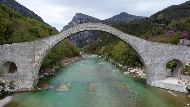 Aerial Shot of Plaka Bridge At Tzoumerka Epirus, Arahthos Greece (largest one-arch stone bridge in the Balkans), Footage