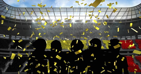 Golden confetti falling over silhouette of fans cheering against sports stadium