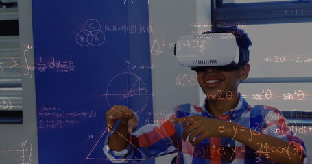 Image of mathematical equations over schoolchildren using vr headsets