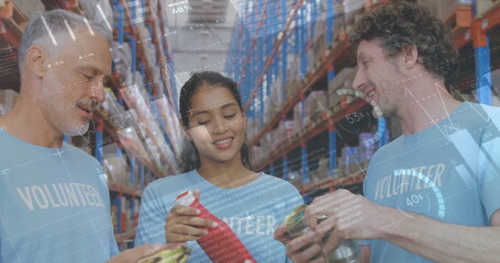 Image of statistics and data processing over smiling volunteers working in warehouse