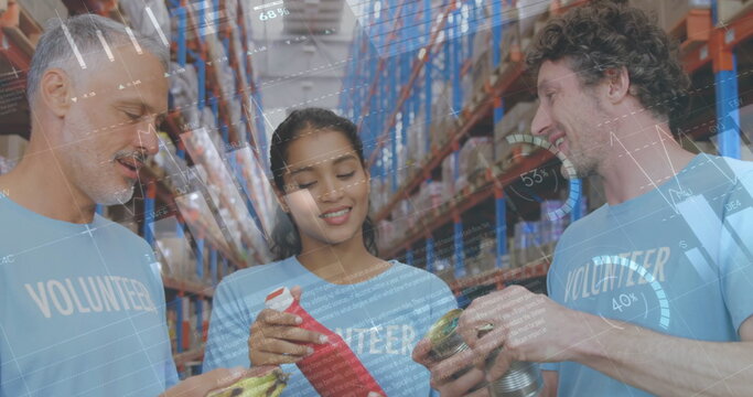 Image of statistics and data processing over smiling volunteers working in warehouse - Powered by Adobe
