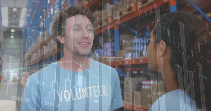 Image of statistics and data processing over smiling volunteers working in warehouse - Powered by Adobe