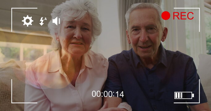 Image of play screen over caucasian senior couple