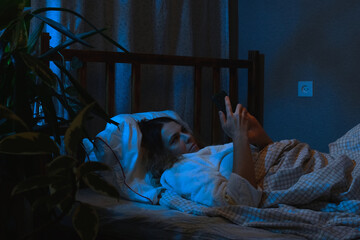 Insomnia. Woman lying awake in bed at night. - 757764227