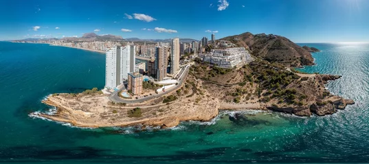 Poster Extremely wide aerial drone photo of the norther part of Benidorm in Spain showing the Cala Almadraba Beach and the main Llevant beach on a sunny day in the summer time. © Duncan