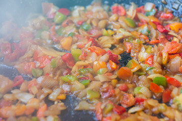Sublime stir-fry: Close-up of vegetables simmering for creamy rice.