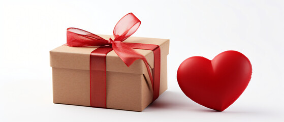 Gift box and decorative heart isolated on white ..