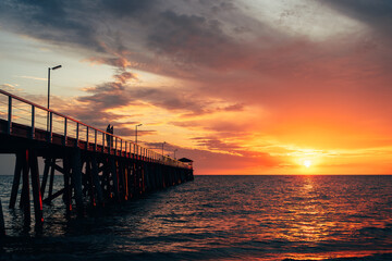 Fototapeta na wymiar Dynamic sunset over Grange jetty, Adelaide, South Australia.