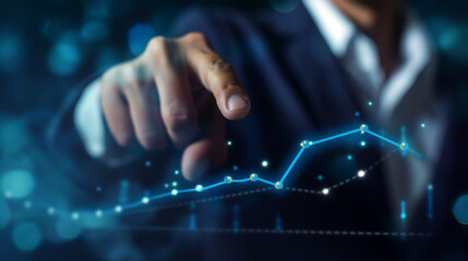 Businessman finger pointing at stock market chart or financial diagram