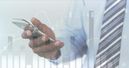 Image of statistics and data processing over man using smartphone