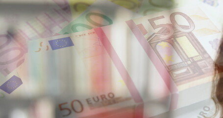 Image of Euro bills over Caucasian woman wearing face mask - Powered by Adobe