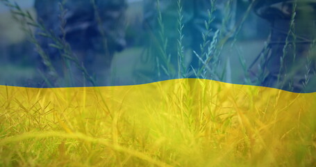 Image of flag of ukraine over boots of soldiers
