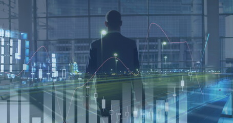 Statistical data processing against rear view of businessman with trolley bag and night city traffic