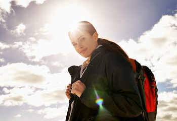Ready, sky and portrait of woman hiking in adventure or outdoor travel for holiday vacation....