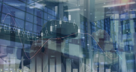 Image of financial data over caucasian woman using vr headset in office