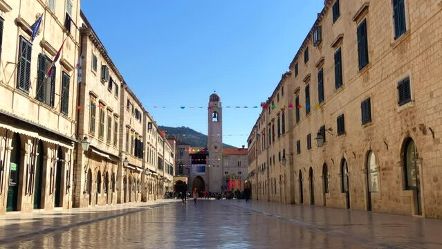 Historic esplanade. Stradun boulevard. Historic old town. UNESCO World Heritage site. Slow motion. Dubrovnik, Croatia. Europe.