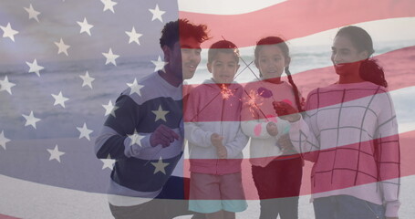 Obraz premium Image of flag of united states of america over biracial couple with children by seaside